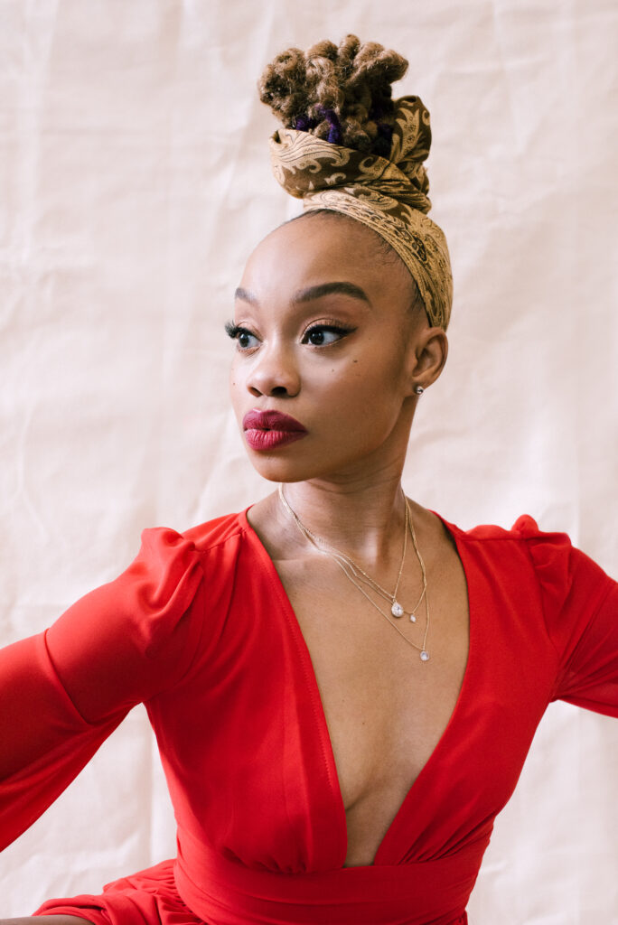 Camille Brown in red dress