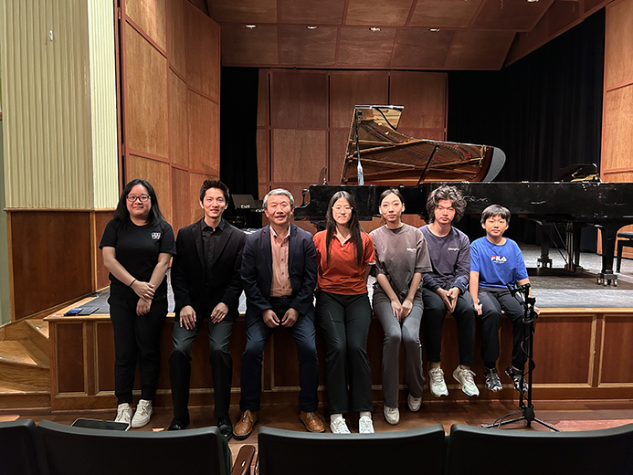 Group of students seated on stage