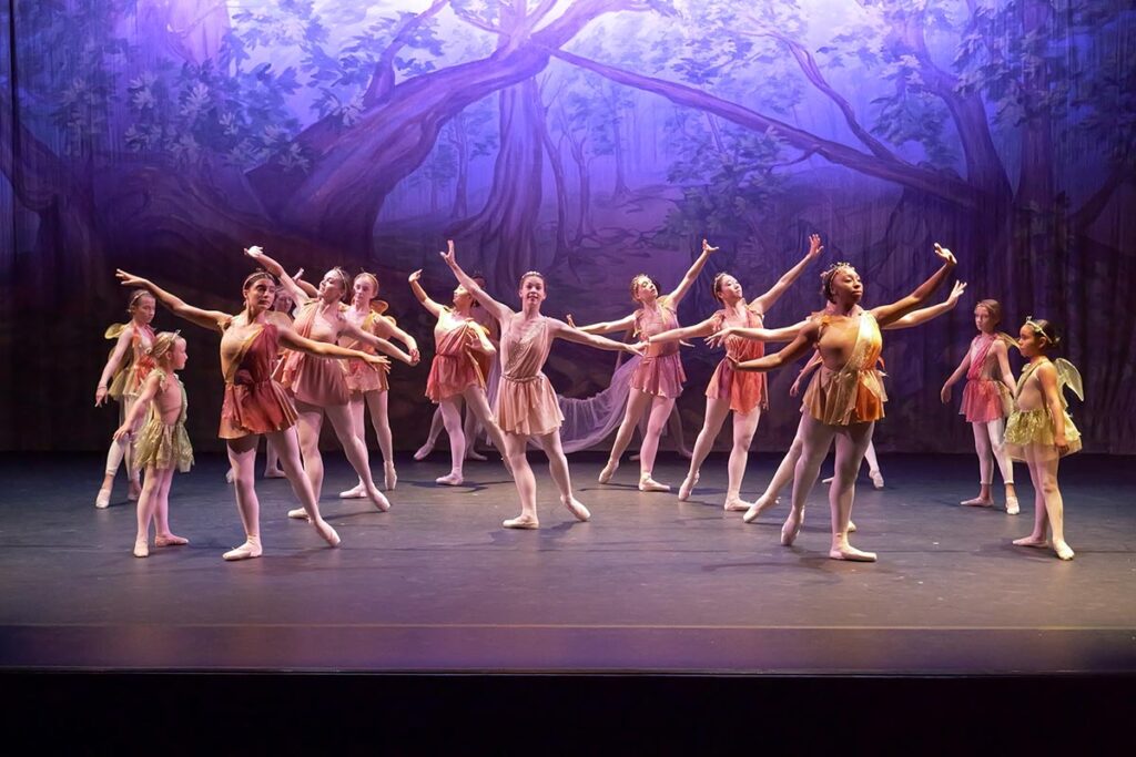 Group of dancers on stage in Midsummer