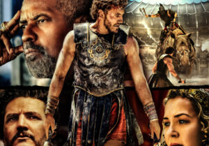 Gladiator stands in front of photos of four people